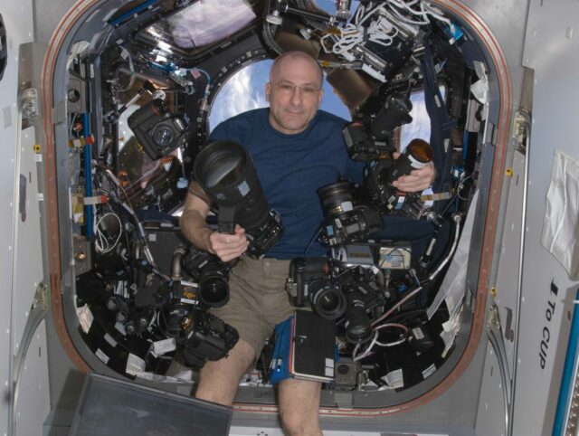 Nasa Astronaut And Flight Engineer Donald Pettit Poses With Ten Nikon Dslrs On The International Space Station