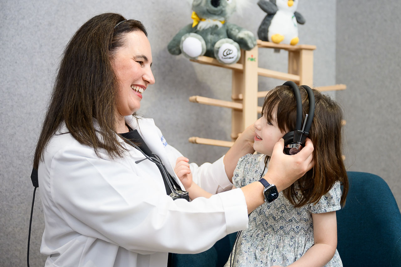 ENT Surgeon testing paediatric patient hearing