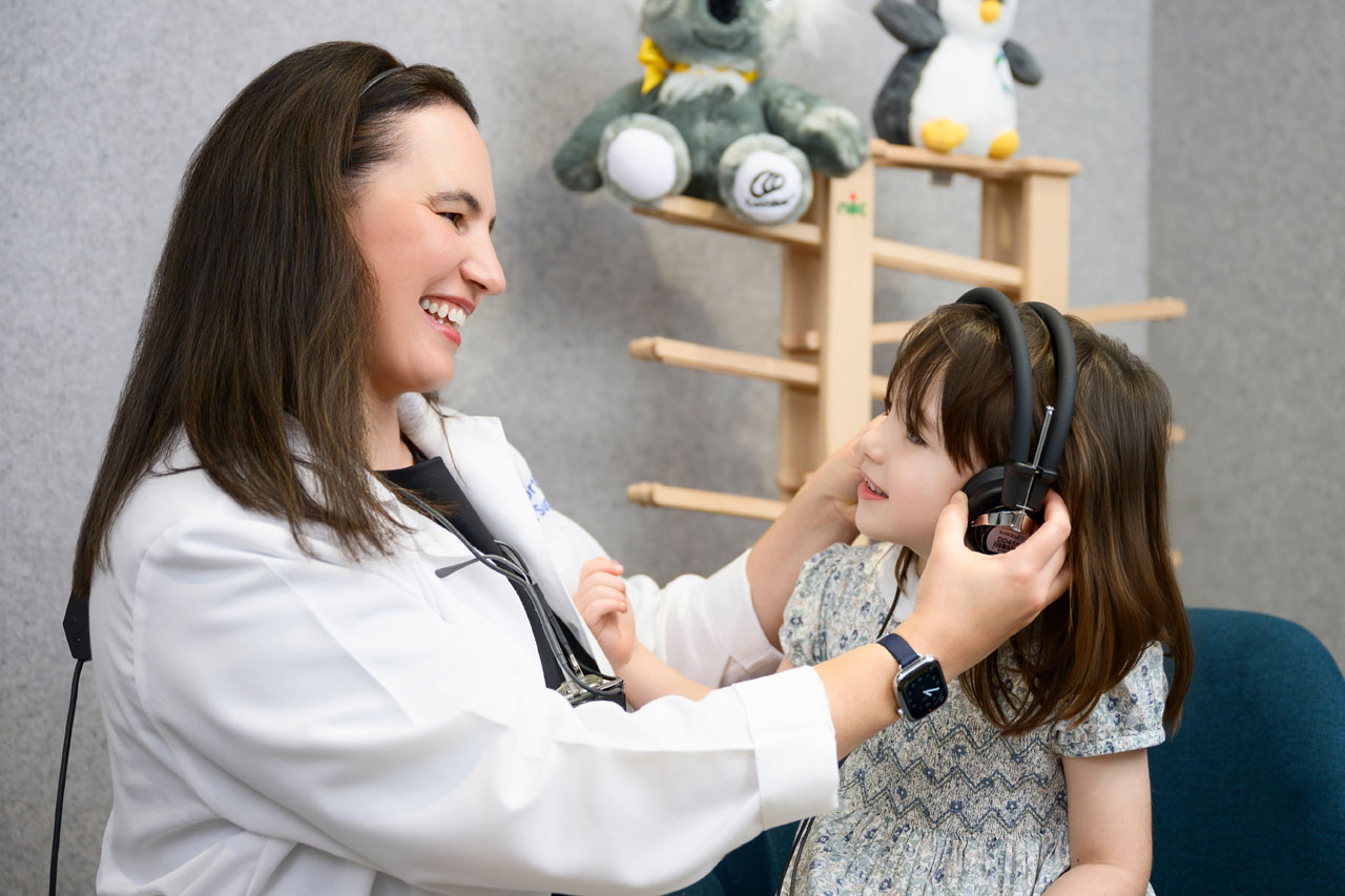 ENT Surgeon testing paediatric patient hearing