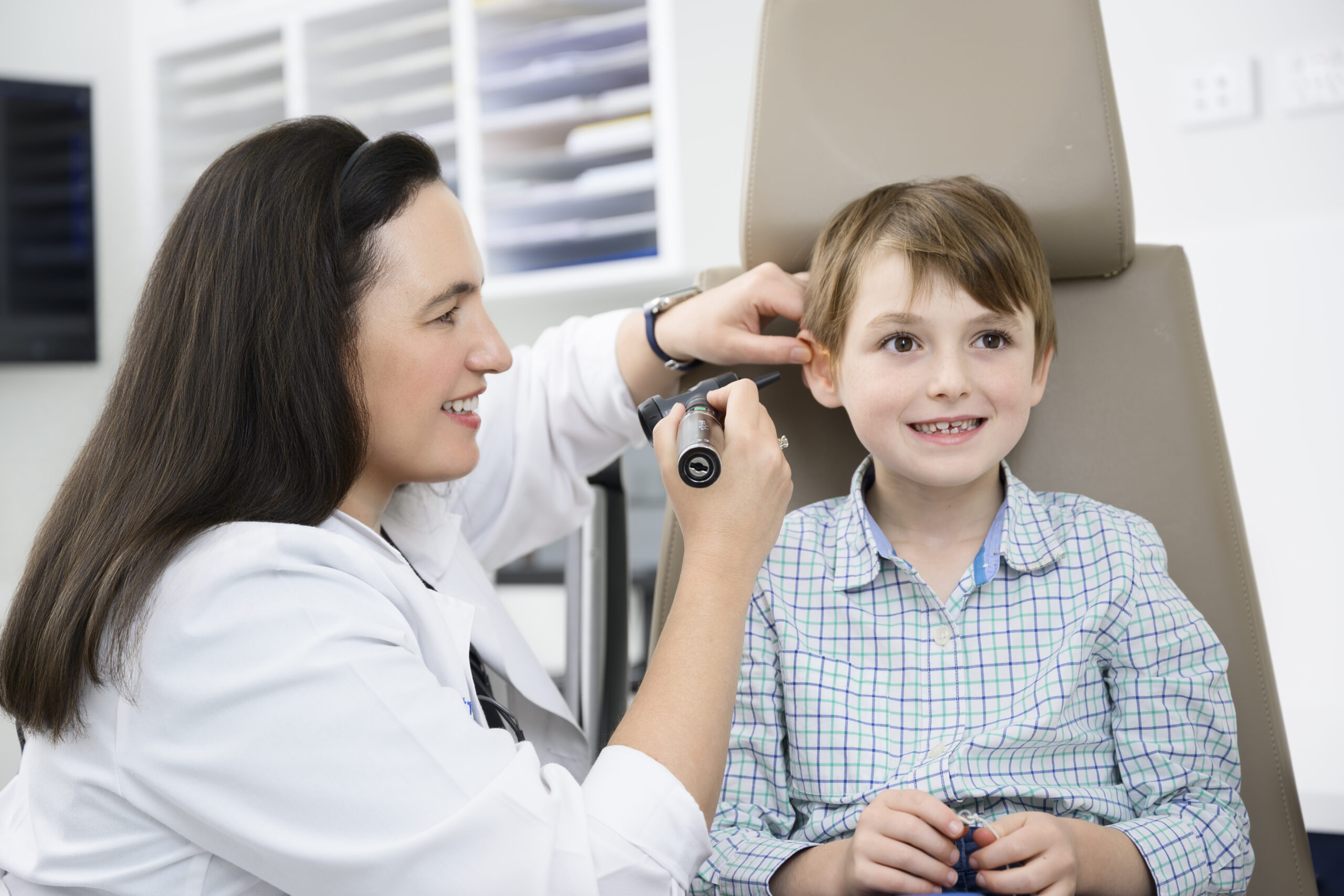 Pediatric ENT surgeon consulting patient